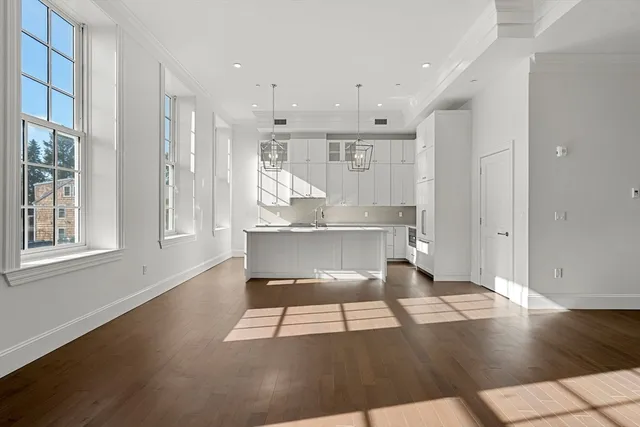 a view of kitchen with furniture and wooden floor