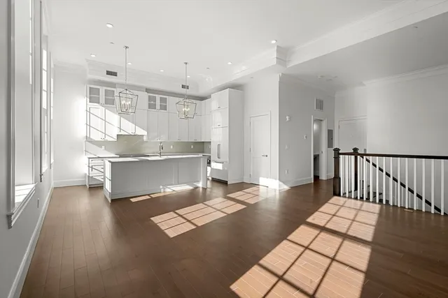 a view of kitchen with stainless steel appliances cabinets