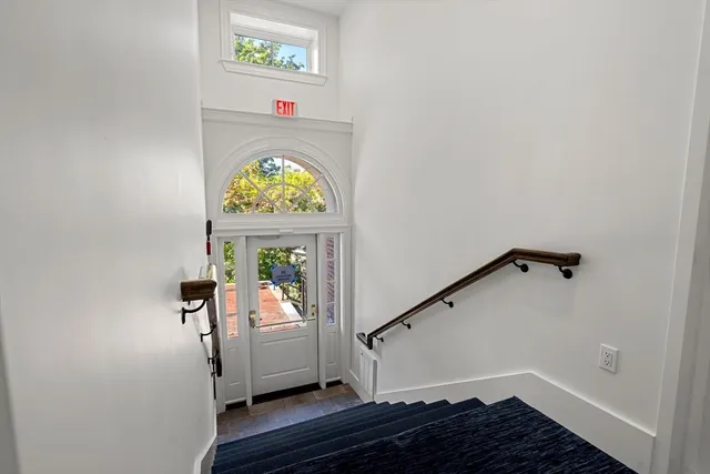 a view of entryway with wooden floor