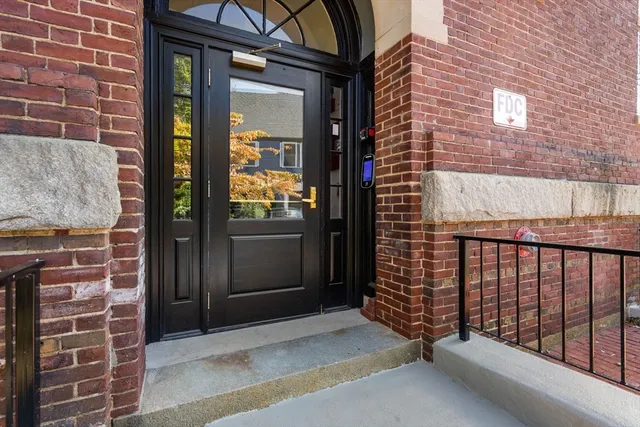 a view of a porch with a door and a window