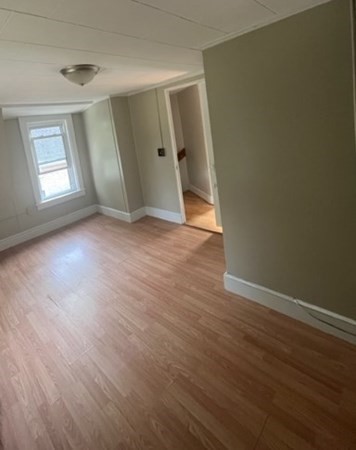 76 Squanto Road Weymouth, MA 02191 - Photo 20 of 22 an empty room with wooden floor and windows