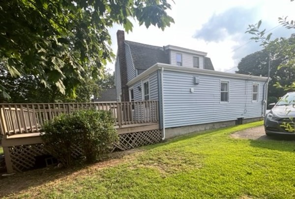 76 Squanto Road Weymouth, MA 02191 - Photo 4 of 22 a view of a house with backyard and sitting area