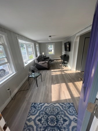 76 Squanto Road Weymouth, MA 02191 - Photo 6 of 22 a living room with furniture and a rug