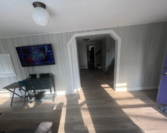 76 Squanto Road Weymouth, MA 02191 - Photo 8 of 22 a living room with furniture and a flat screen tv