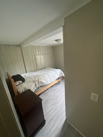 76 Squanto Road Weymouth, MA 02191 - Photo 10 of 22 a bed sitting in a room next to a window