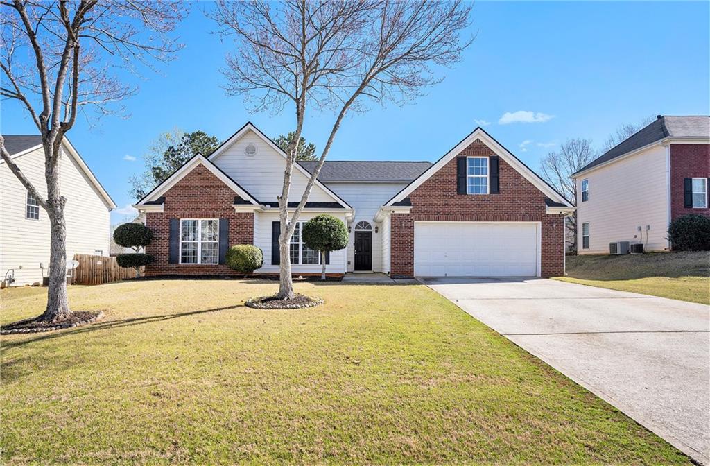 a front view of a house with a yard