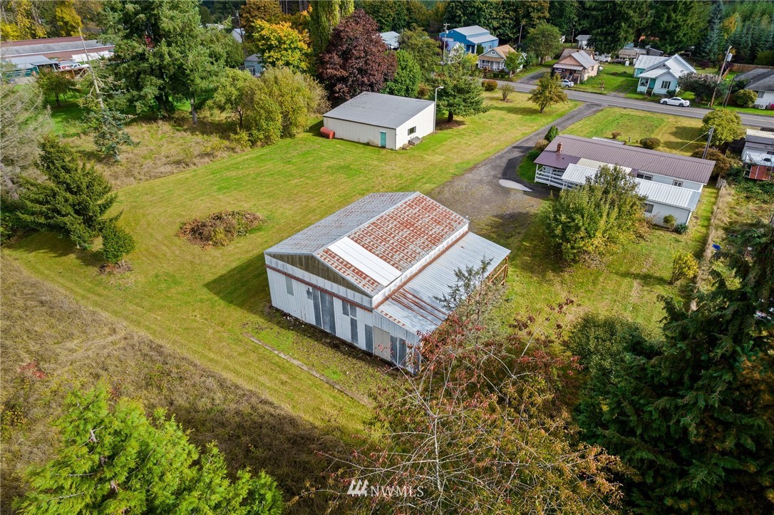 253 Stowell Road Salkum, WA 98582 - Photo 1 of 31 a view of a swimming pool with lawn chairs and plants