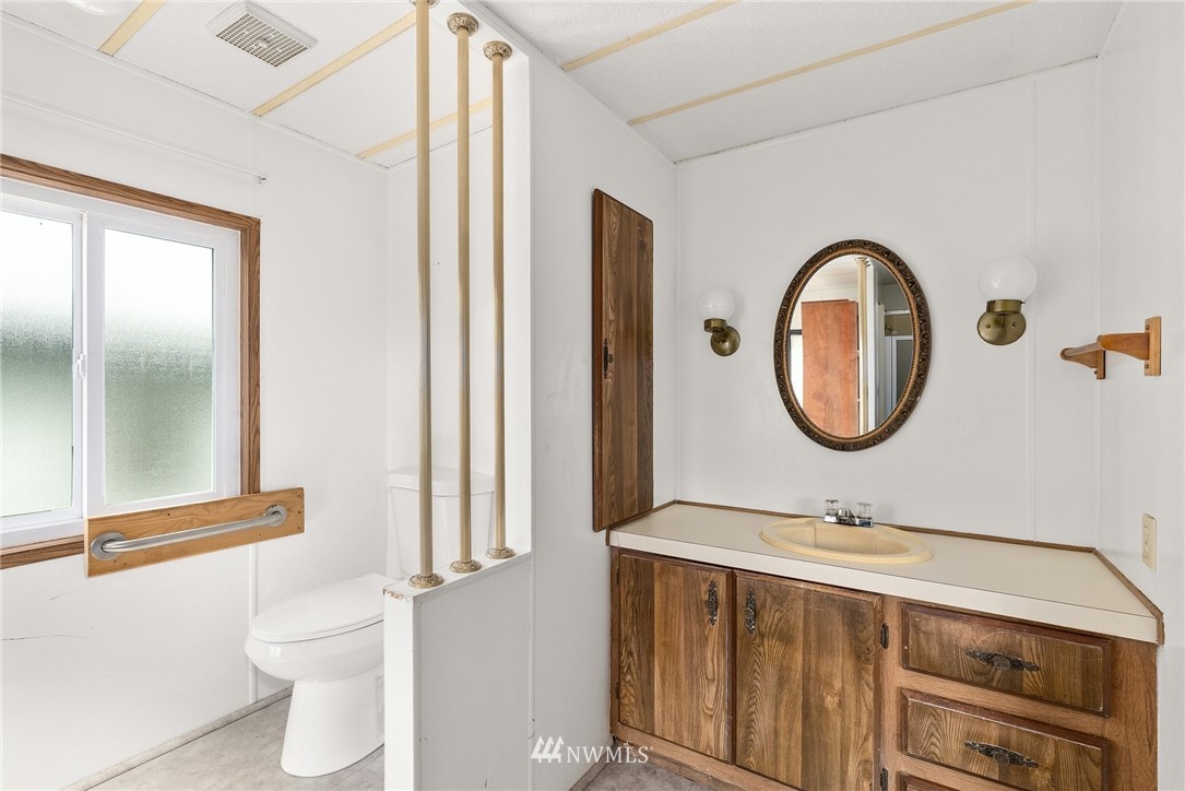 253 Stowell Road Salkum, WA 98582 - Photo 18 of 31 a bathroom with a toilet a sink and a mirror