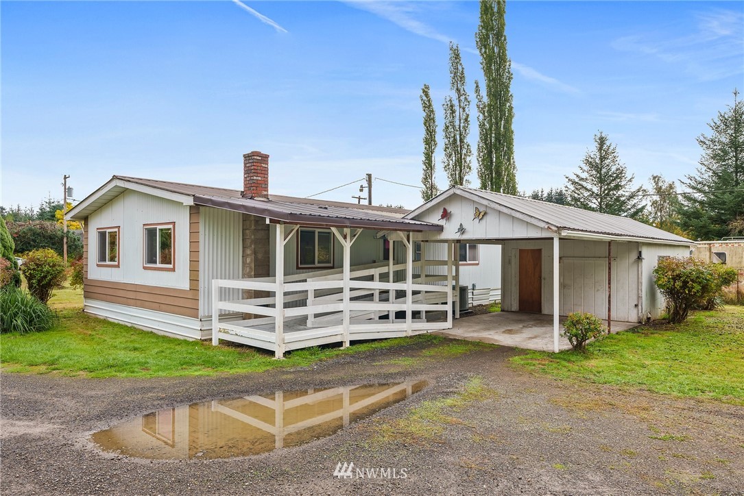 253 Stowell Road Salkum, WA 98582 - Photo 23 of 31 a view of a house with a yard and sitting area