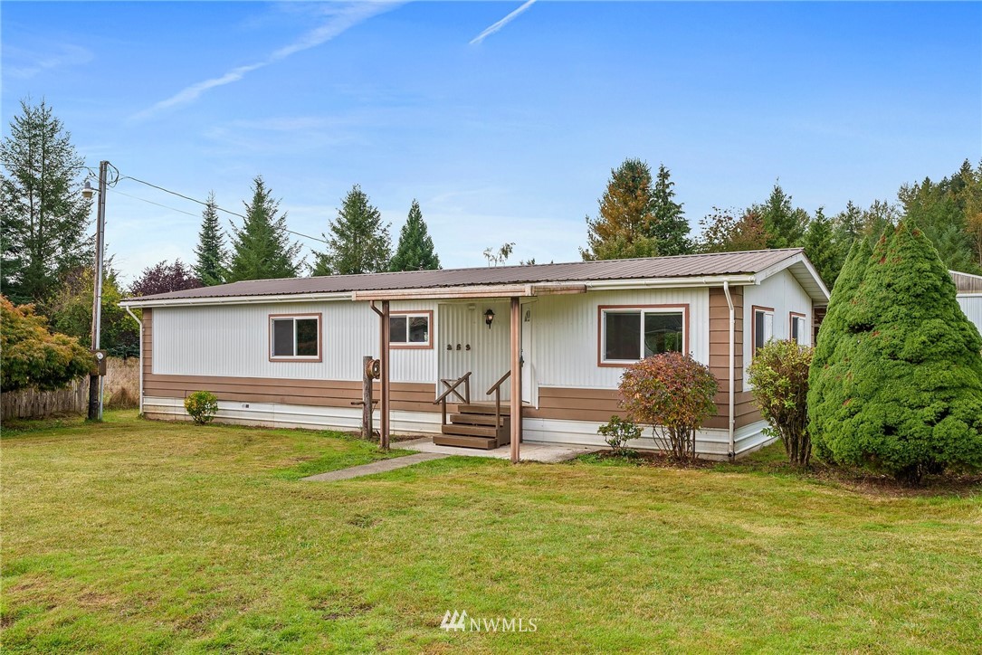253 Stowell Road Salkum, WA 98582 - Photo 5 of 31 a backyard of a house with garden barbeque oven and outdoor seating