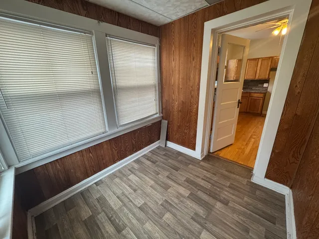 a view of front door with wooden floor