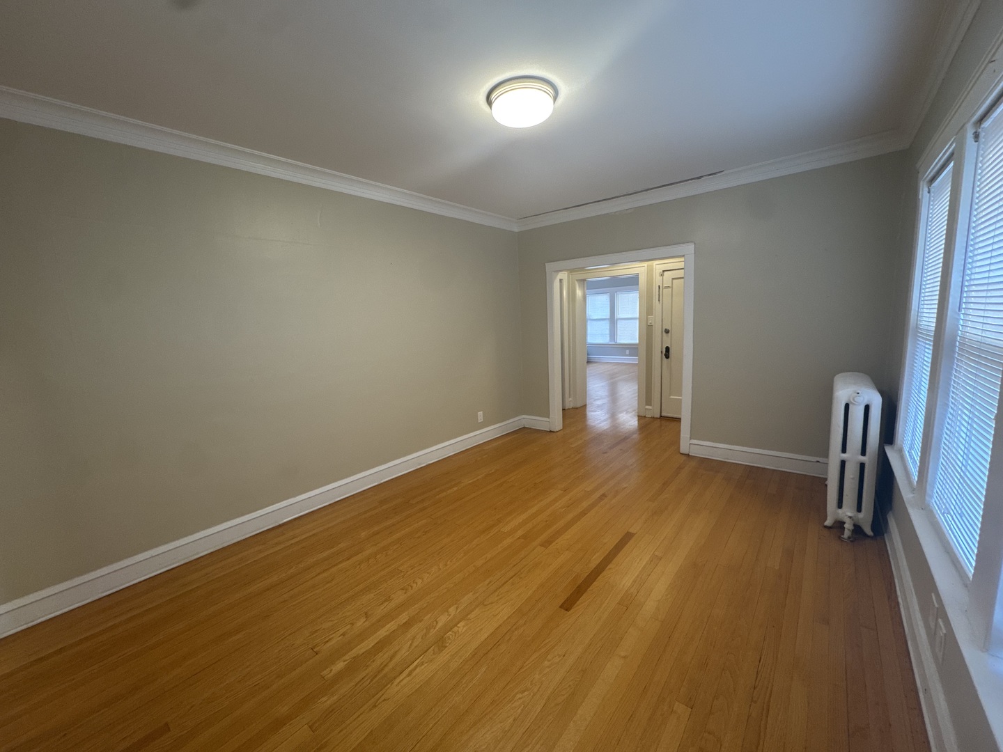 6208 North Artesian Avenue, Unit 2 Chicago, IL 60659 - Photo 4 of 14 a view of empty room with wooden floor