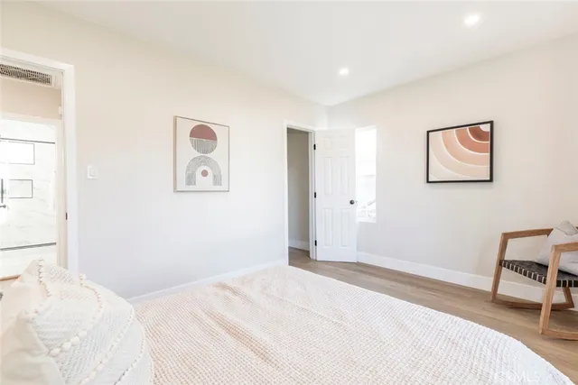 a bedroom with a bed and a chair