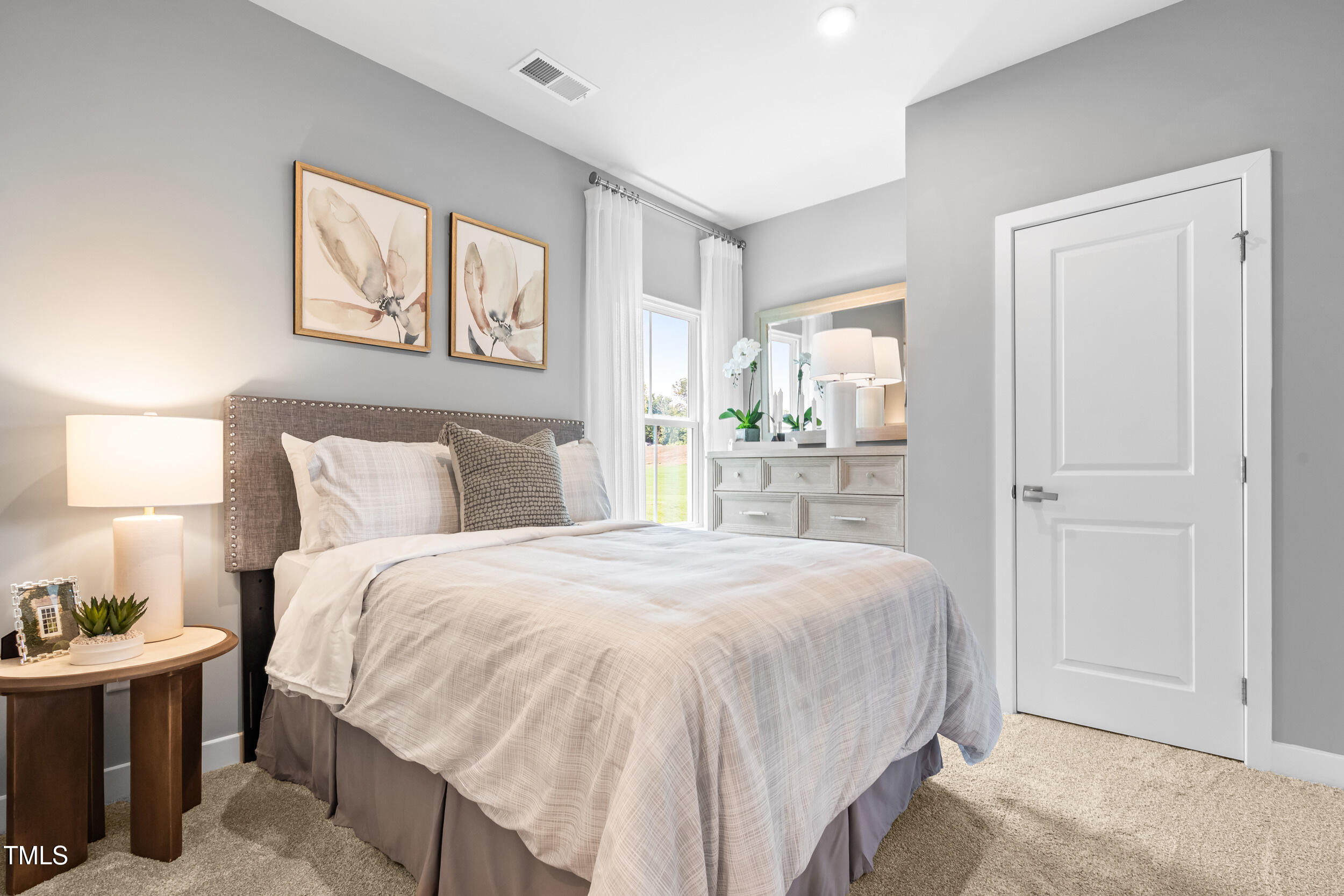 809 Walker Rdg Way Willow Spring, NC 27592 - Photo 13 of 33 a bedroom with a bed and a window