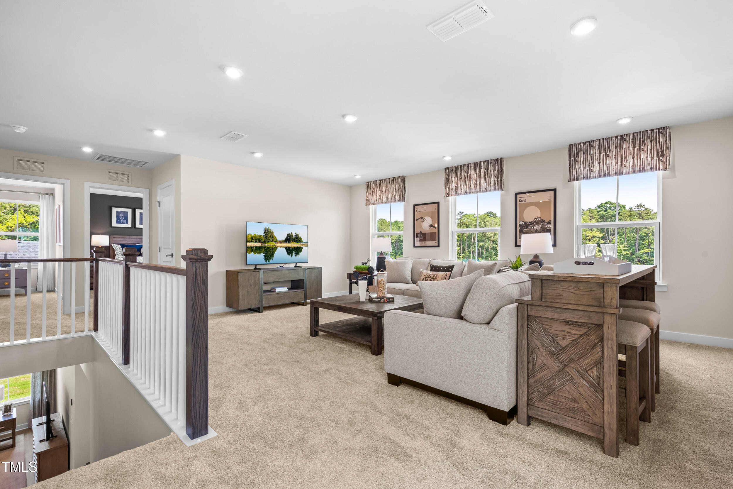809 Walker Rdg Way Willow Spring, NC 27592 - Photo 15 of 33 a living room with furniture and a large window