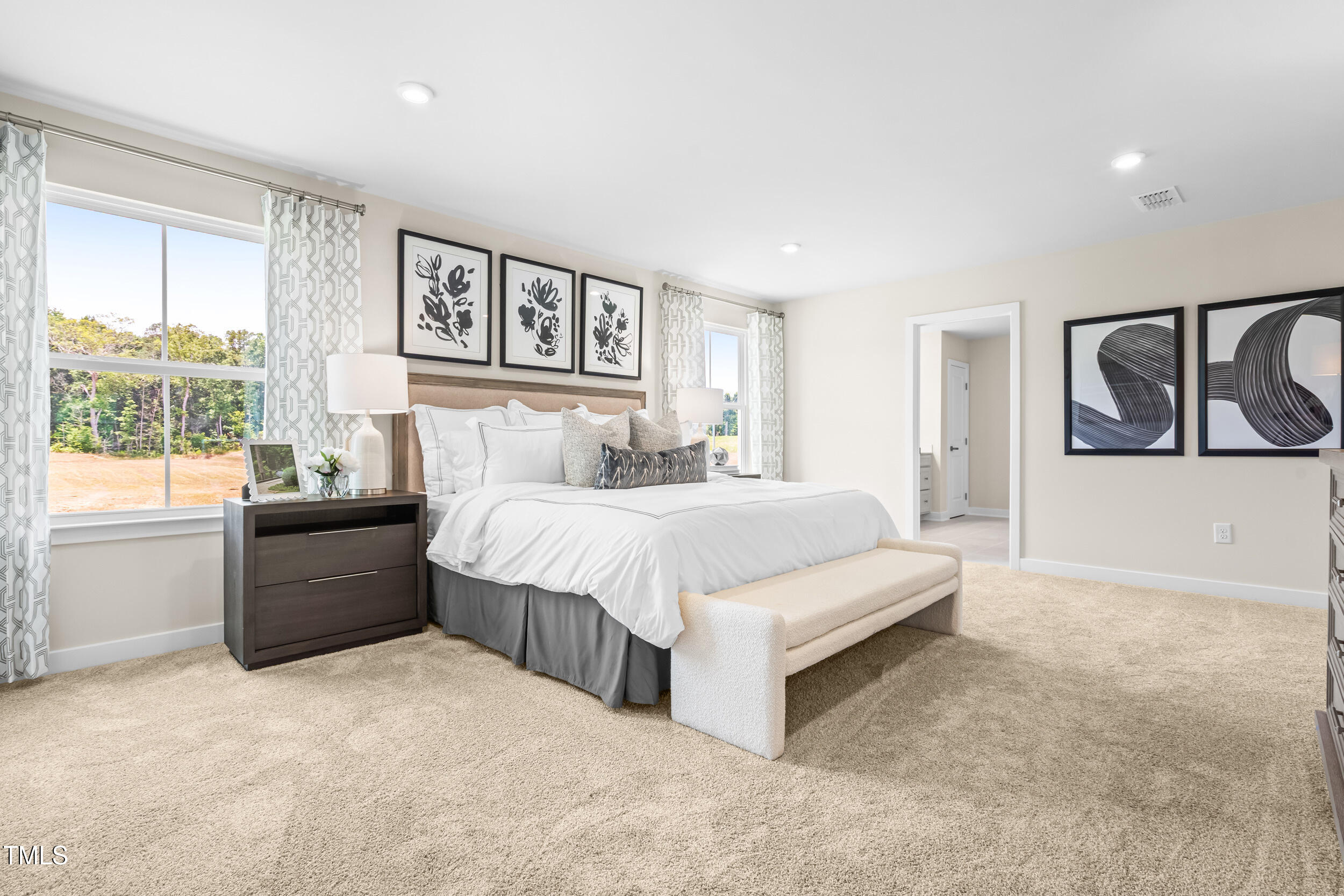 809 Walker Rdg Way Willow Spring, NC 27592 - Photo 18 of 33 a spacious bedroom with a large bed and a window