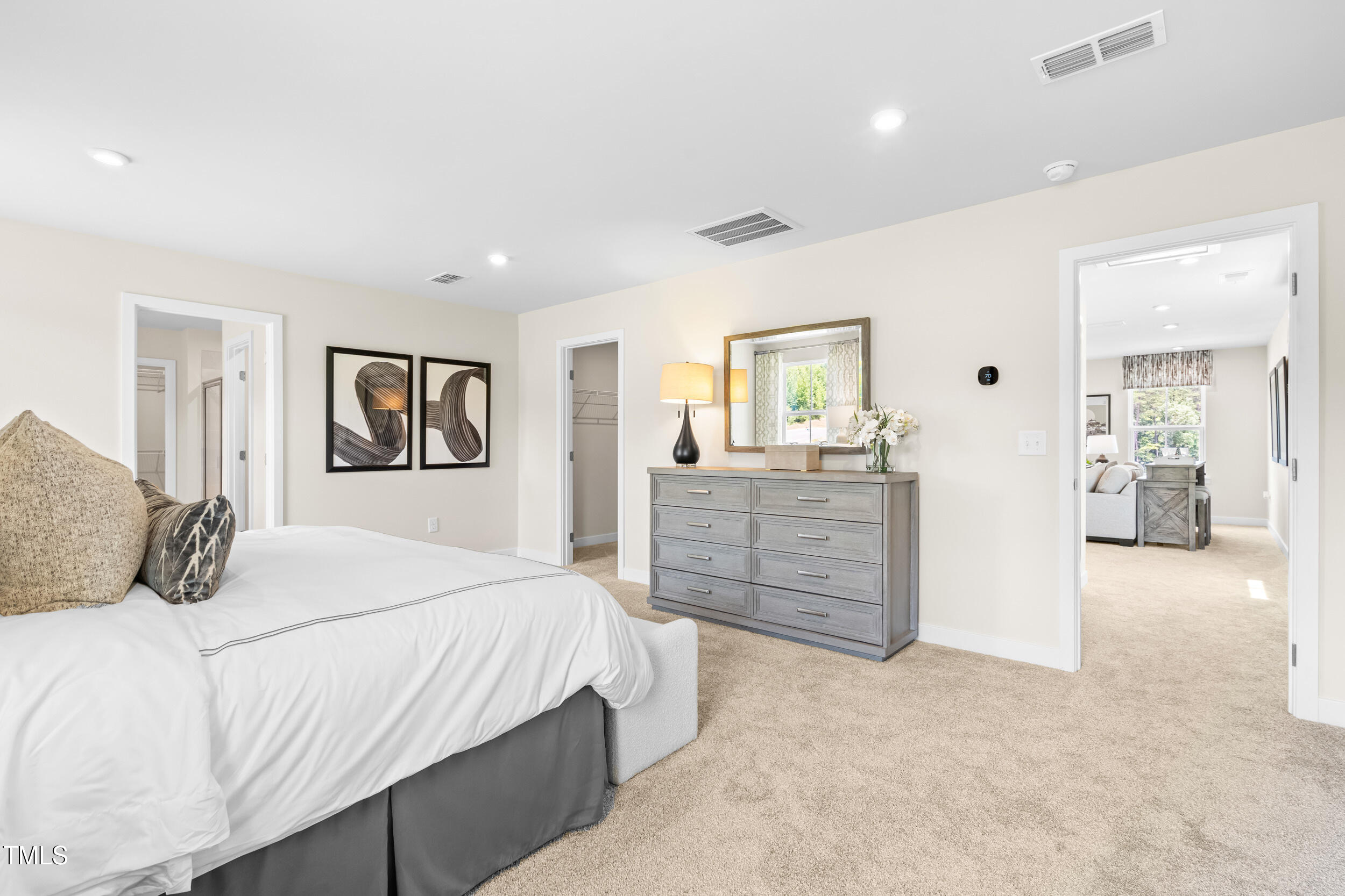 809 Walker Rdg Way Willow Spring, NC 27592 - Photo 20 of 33 a bedroom with a large bed and dresser
