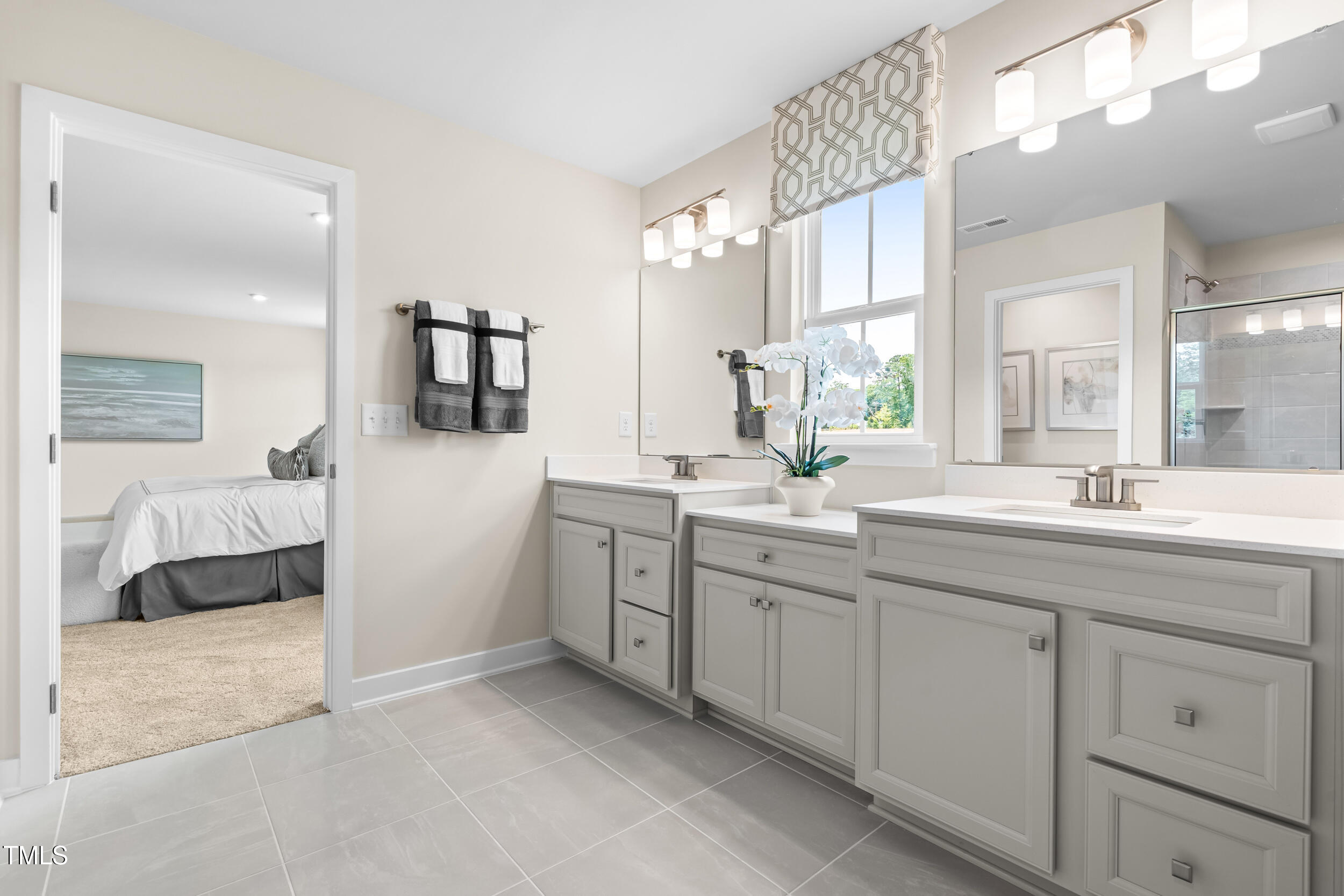 809 Walker Rdg Way Willow Spring, NC 27592 - Photo 21 of 33 a spacious en suite bathroom with double sink and a large mirror