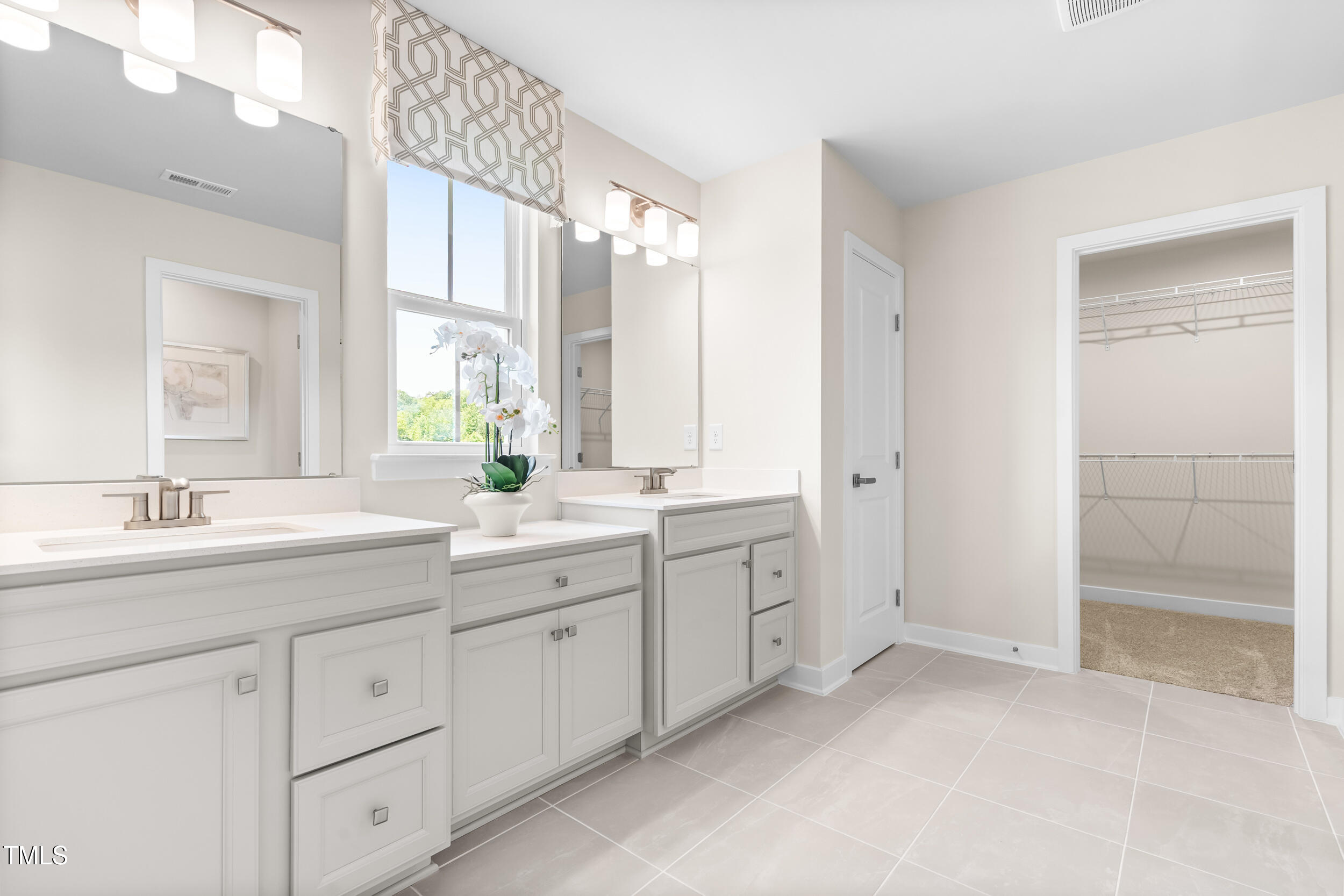 809 Walker Rdg Way Willow Spring, NC 27592 - Photo 22 of 33 a spacious bathroom with double sink and a mirror