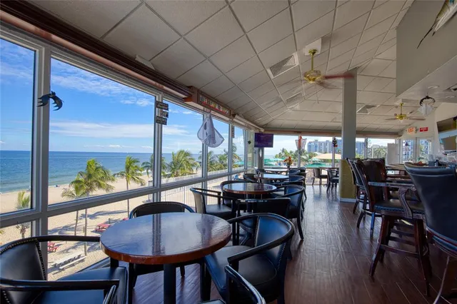a view of a dining room with furniture window and outside view
