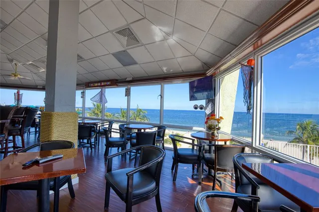 a view of a dining room with furniture window and outside view