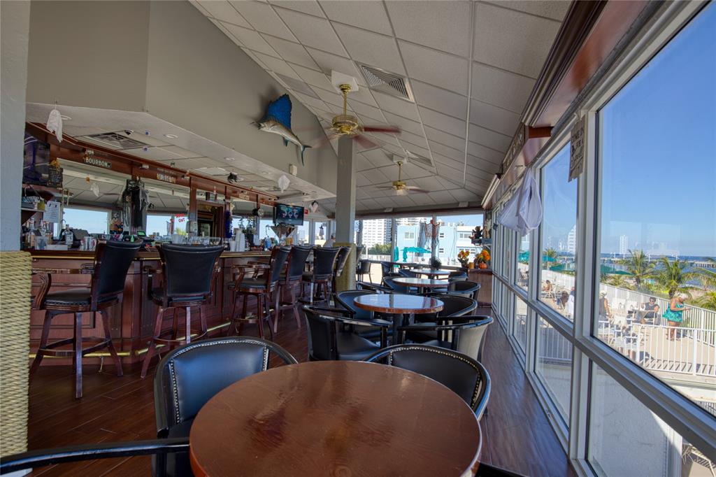 111 Briny Avenue, Unit 2008 Pompano Beach, FL 33062 - Photo 35 of 50 a view of a dining room with furniture window and outside view