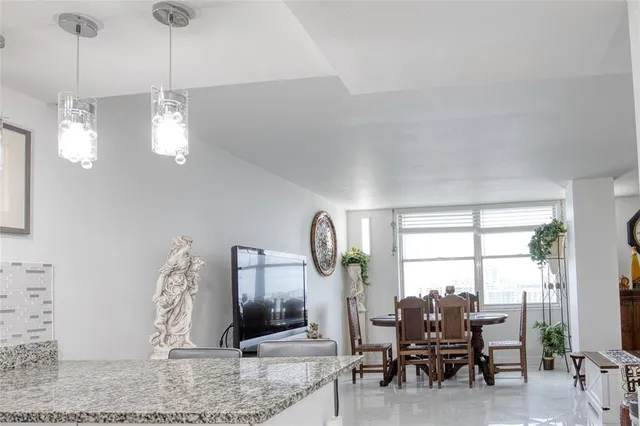 a view of a livingroom with furniture and window