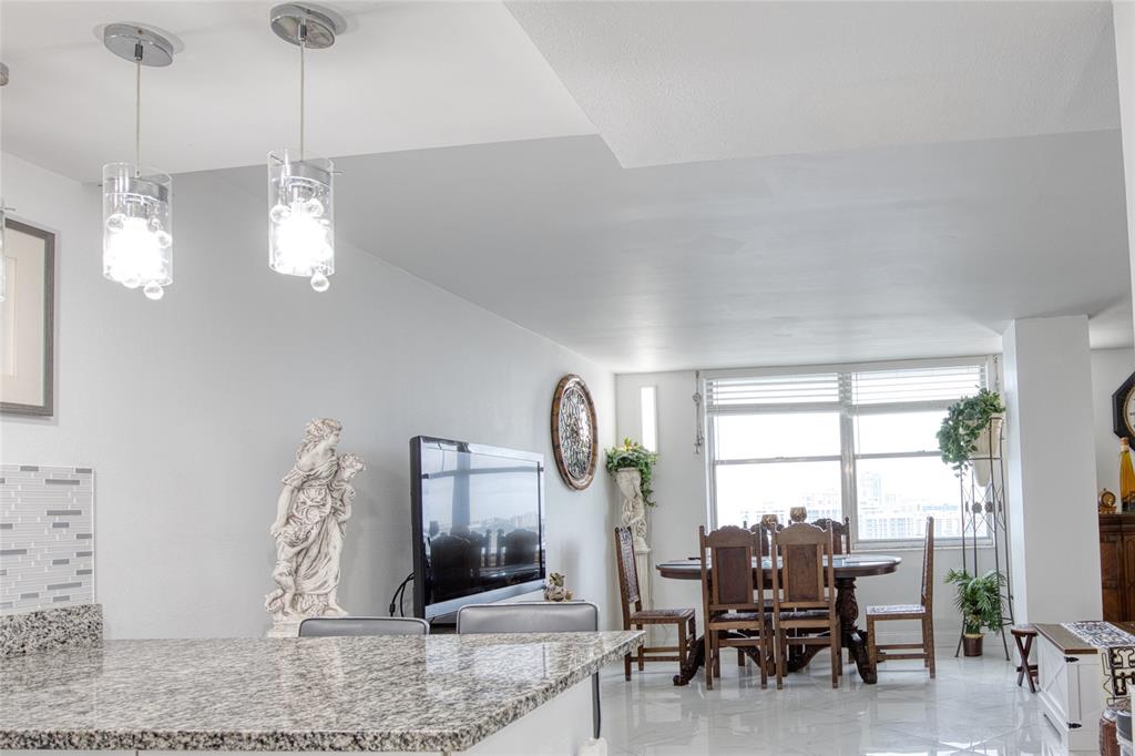 111 Briny Avenue, Unit 2008 Pompano Beach, FL 33062 - Photo 7 of 50 a view of a livingroom with furniture and window