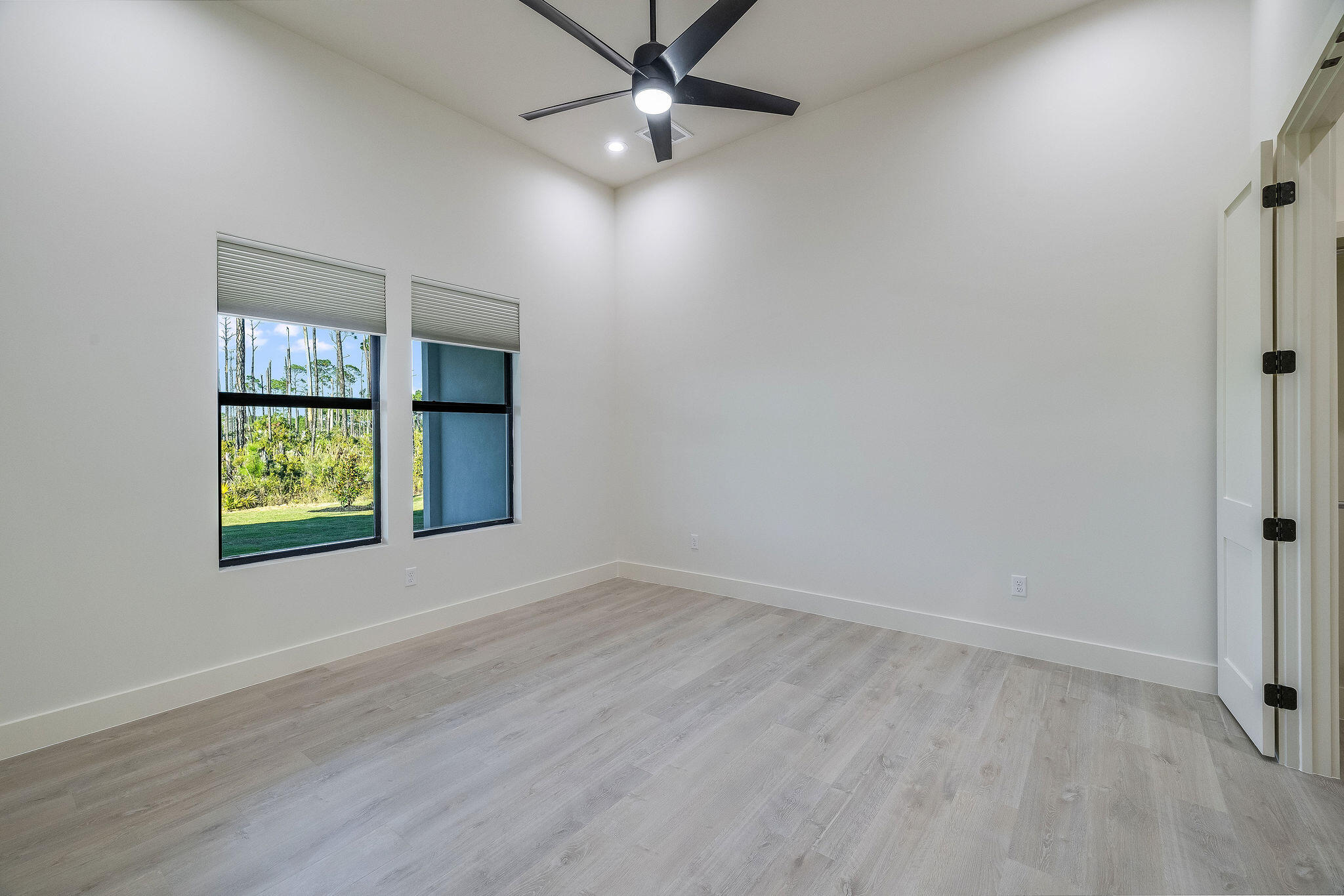 32 Delbert Lane, Unit B Santa Rosa Beach, FL 32459 - Photo 7 of 13 an empty room with windows and fan