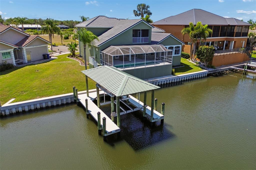703 Bunker View Drive Apollo Beach, FL 33572 - Photo 49 of 49 an aerial view of a house with swimming pool patio and outdoor seating