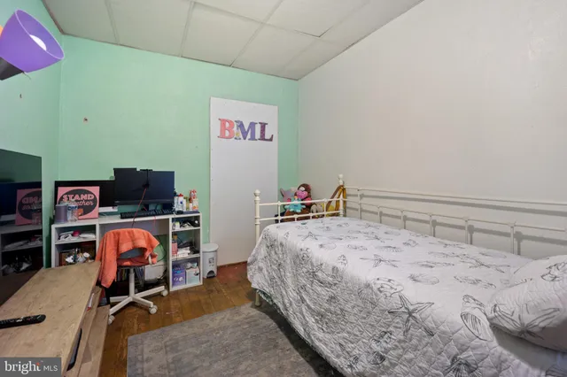 a bedroom with bed and cabinets