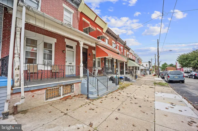 a view of a patio with table and chairs