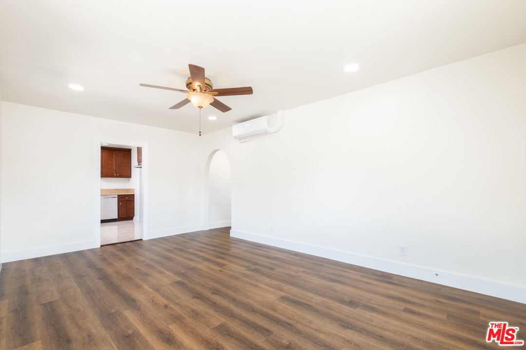 626 Silver Boulevard Los Angeles, CA 90026 - Photo 8 of 24 a view of a big room with wooden floor and a chandelier fan