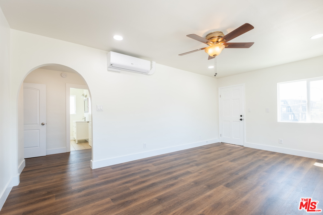 626 Silver Boulevard Los Angeles, CA 90026 - Photo 9 of 24 a view of a room with wooden floor and ceiling fan