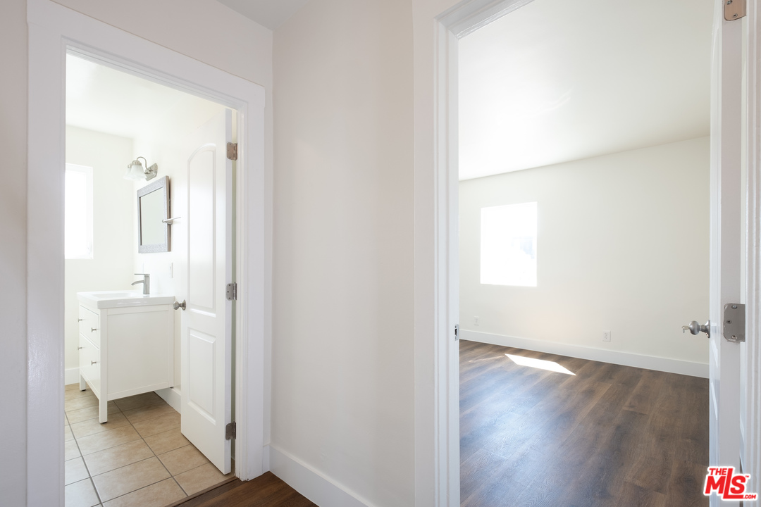 626 Silver Boulevard Los Angeles, CA 90026 - Photo 10 of 24 a bathroom with a granite countertop sink