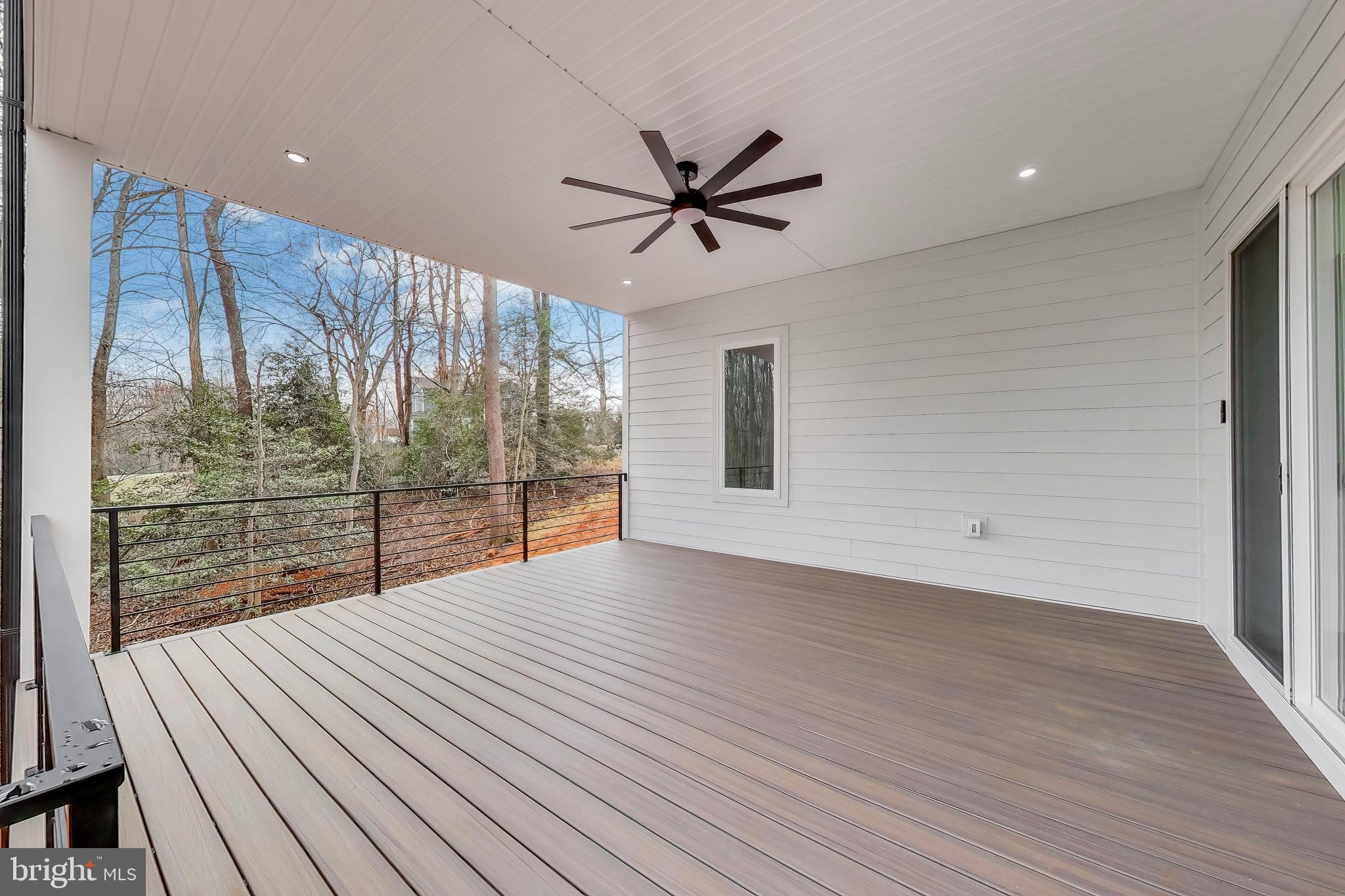 6634 Davis Ford Road Manassas, VA 20111 - Photo 101 of 120 a view of a livingroom with wooden floor and a ceiling fan