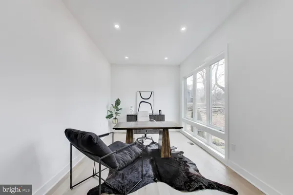 a spacious bathroom with a large tub shower and sink