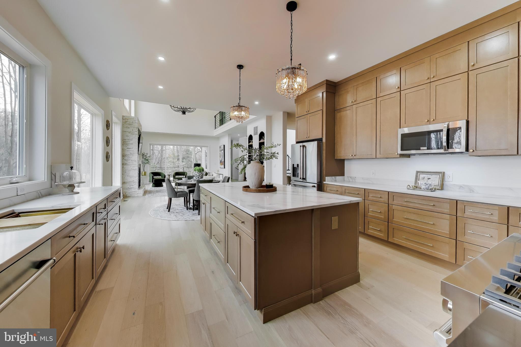 6634 Davis Ford Road Manassas, VA 20111 - Photo 25 of 120 a large kitchen with stainless steel appliances lots of counter space and windows