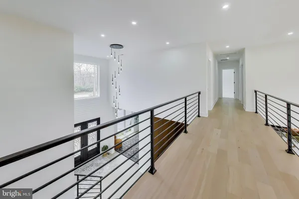 a spacious bedroom with a large bed and a potted plant