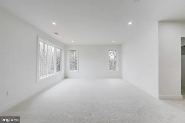 a bedroom with a bed and a flat screen television