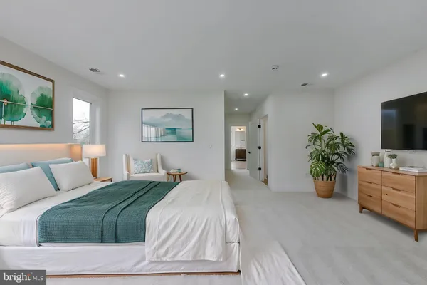 a bathroom with a sink toilet a mirror and shower