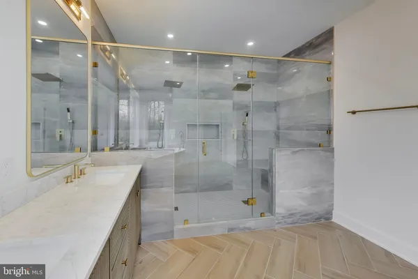 a bedroom with a large bed and a flat screen tv