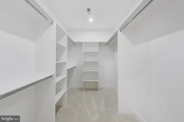 a bedroom with furniture and a flat screen tv