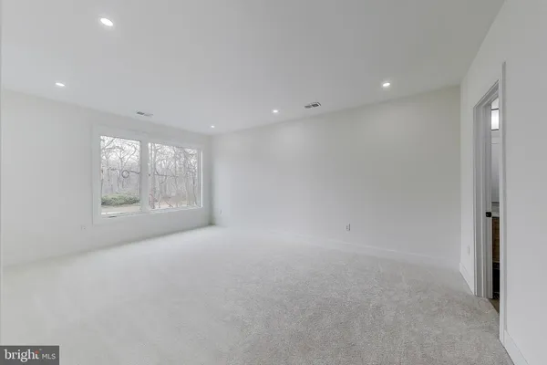 a view of an empty room with stairs