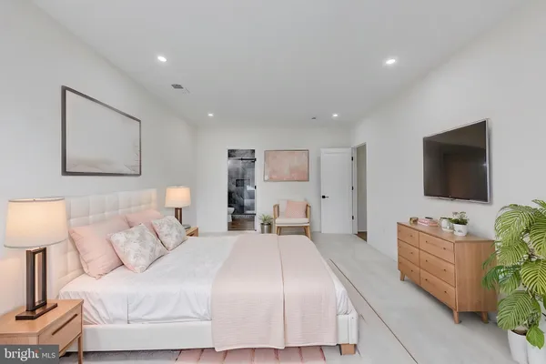 a room with lots of furniture and a wooden floor