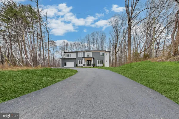 a view of a street with a building in the background