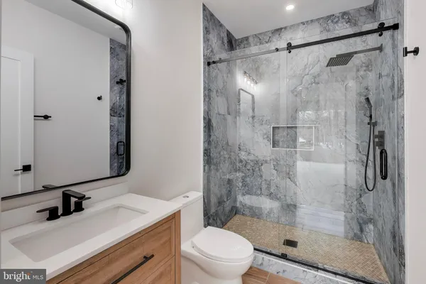 a bedroom with a bed and a couch