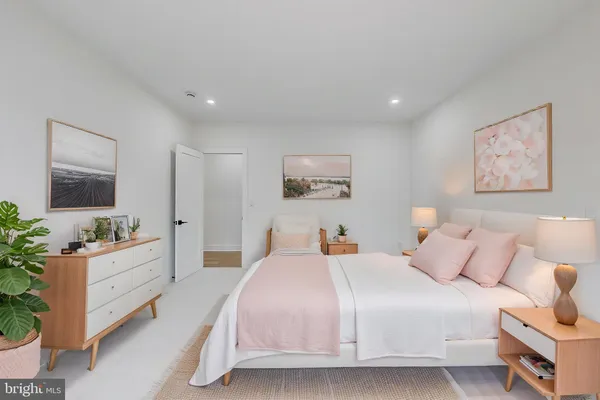 a view of walk in closet with water heater and racks