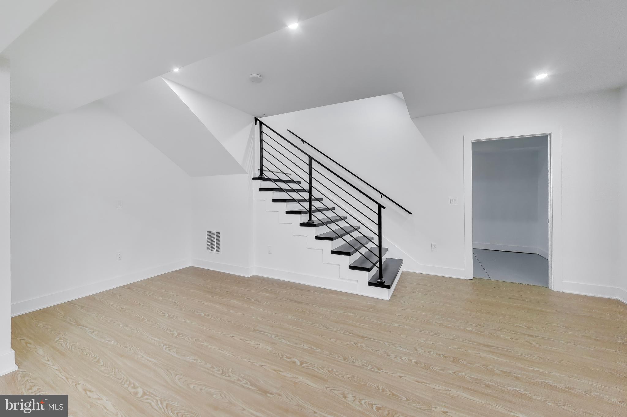 6634 Davis Ford Road Manassas, VA 20111 - Photo 85 of 120 a view of an empty room with stairs