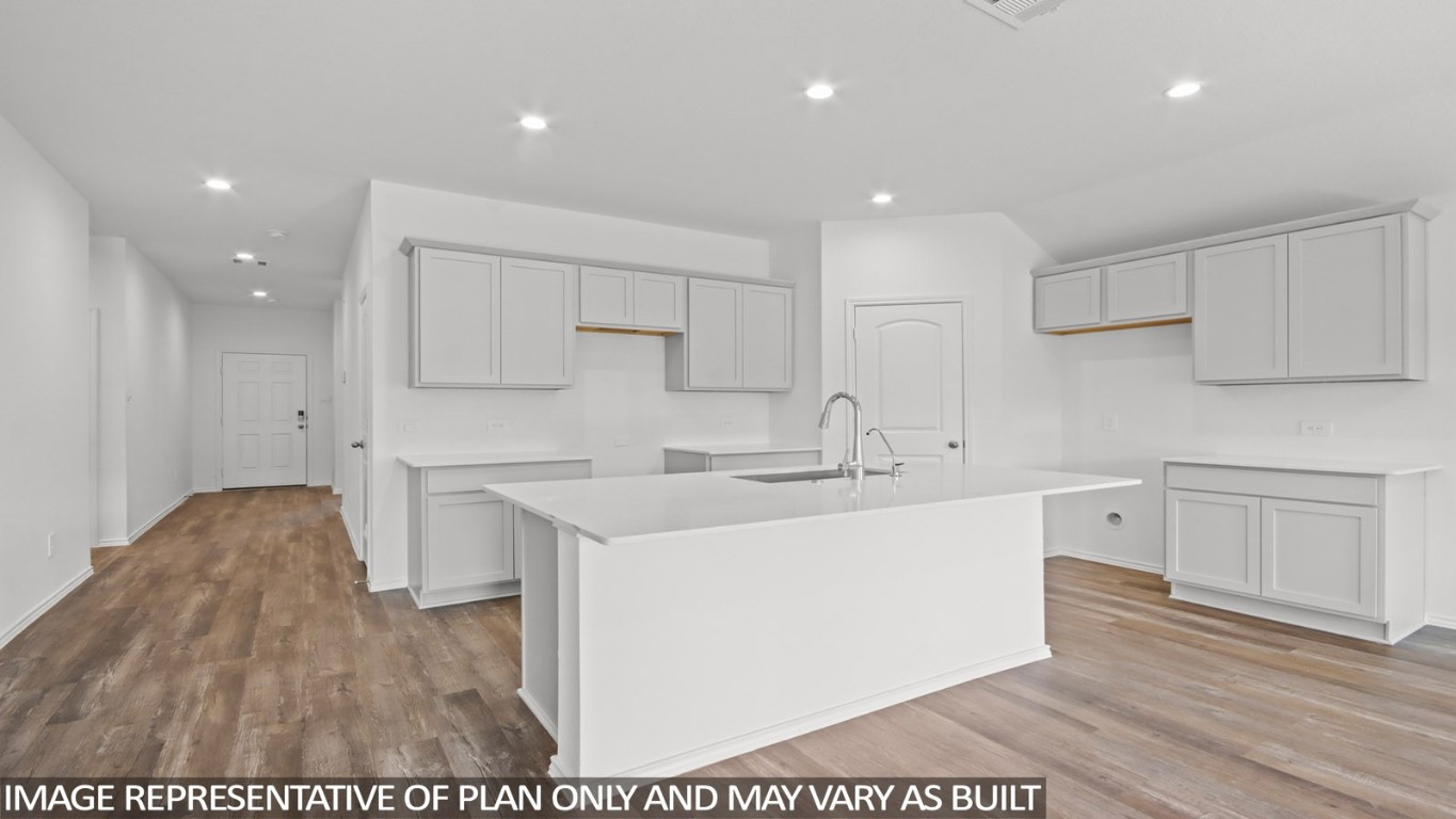 4408 Ledge Court Conroe, TX 77303 - Photo 4 of 26 a kitchen with sink and cabinets